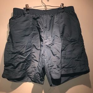 Blue/green AFTCO fishing shorts
